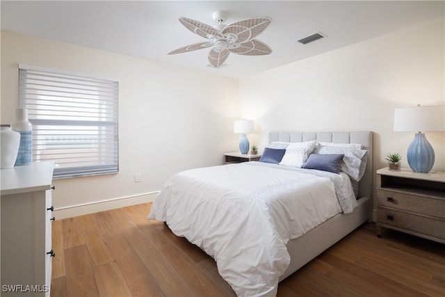 bedroom with dark wood-type flooring and ceiling fan