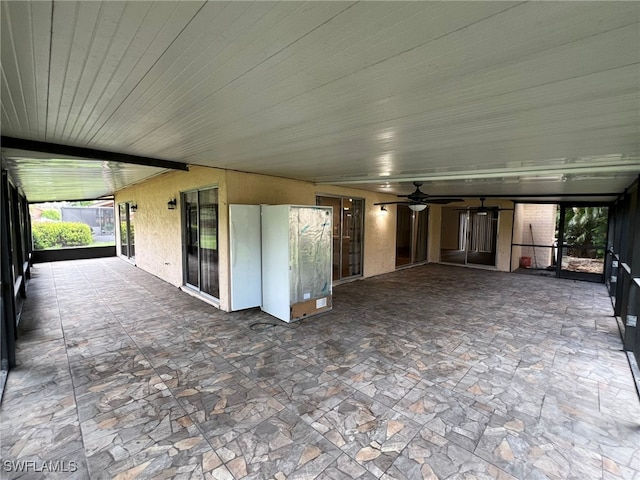 view of patio featuring ceiling fan