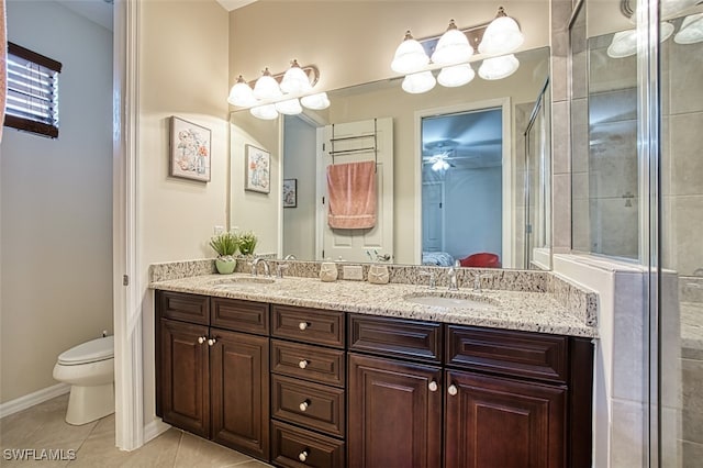 ensuite bathroom featuring ensuite bathroom, tile patterned flooring, a sink, and toilet