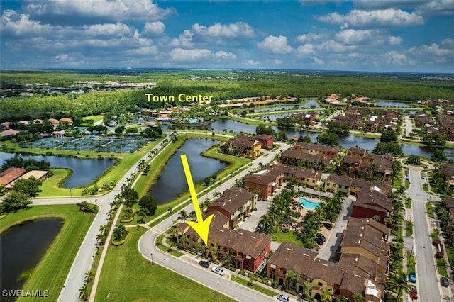 drone / aerial view featuring a water view and a residential view