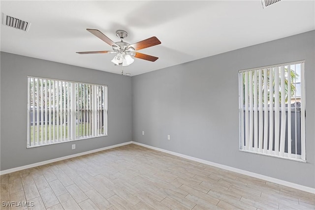 unfurnished room featuring light wood-type flooring and ceiling fan