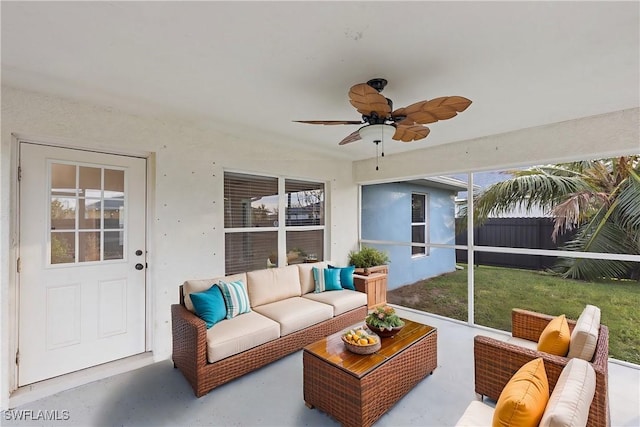 sunroom featuring ceiling fan