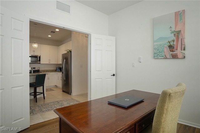 office area with light tile patterned flooring