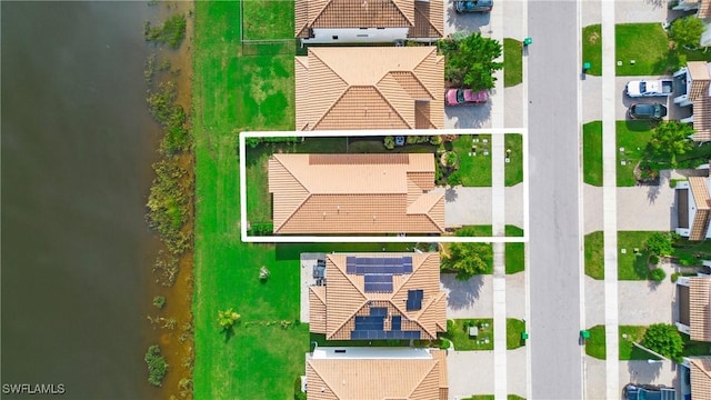 aerial view with a water view and a residential view