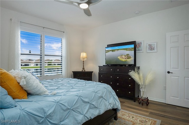 bedroom featuring hardwood / wood-style flooring and ceiling fan