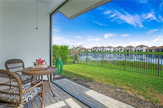 view of patio featuring a water view