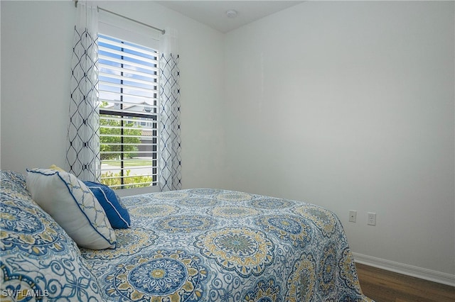 bedroom featuring dark hardwood / wood-style flooring