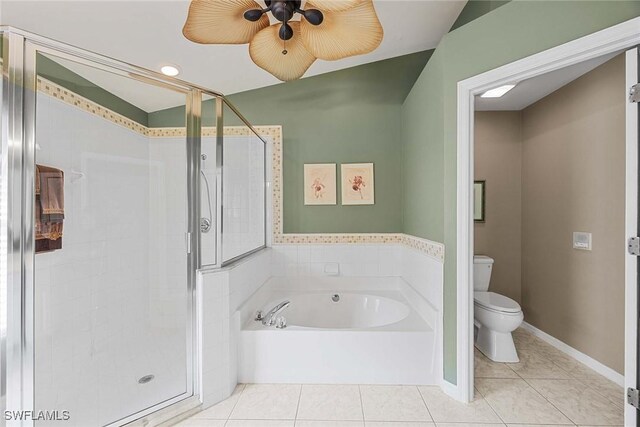 bathroom featuring tile patterned flooring, shower with separate bathtub, toilet, and ceiling fan