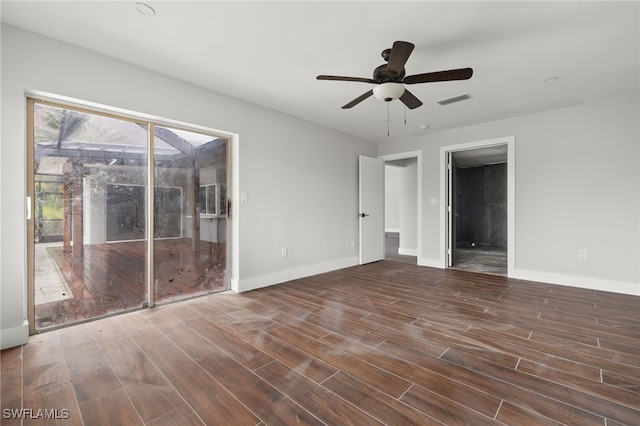 unfurnished room featuring ceiling fan and dark hardwood / wood-style floors