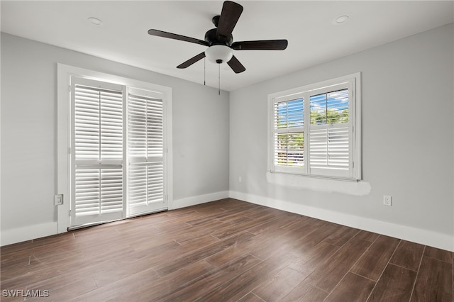 empty room with ceiling fan and hardwood / wood-style floors