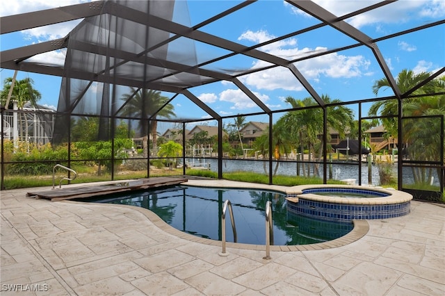 view of swimming pool with a lanai, a water view, an in ground hot tub, and a patio area