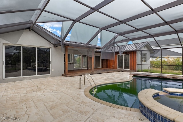 view of swimming pool featuring an in ground hot tub