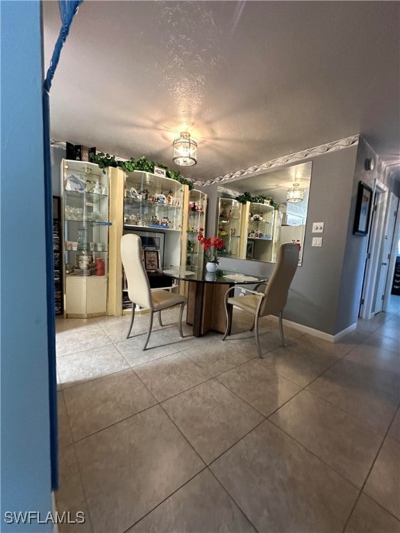 unfurnished dining area with tile patterned floors