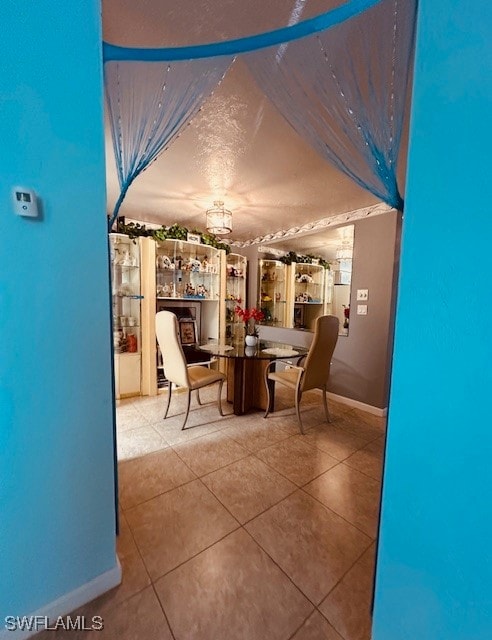 unfurnished dining area with tile patterned floors