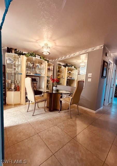 unfurnished dining area featuring light tile patterned flooring