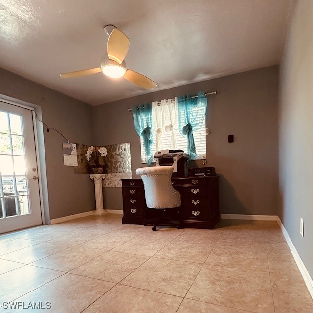 tiled office featuring ceiling fan