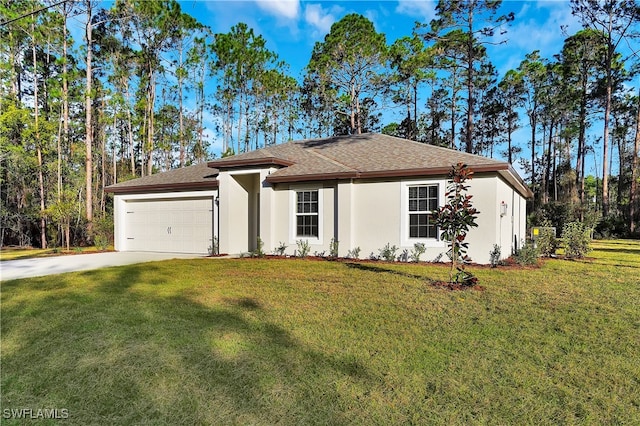 view of front of property with a garage and a front lawn