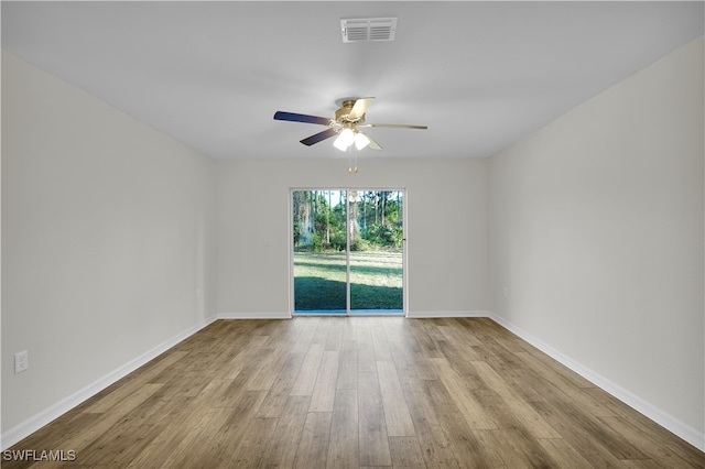 unfurnished room with ceiling fan and light wood-type flooring