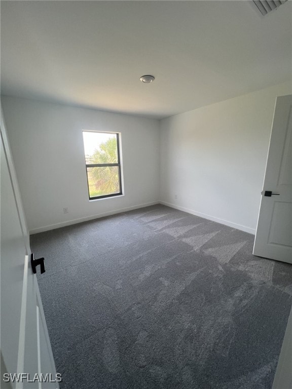 249 Blackstone Dr, Fort Myers, FL 33913 - unfurnished room with dark carpet and baseboards