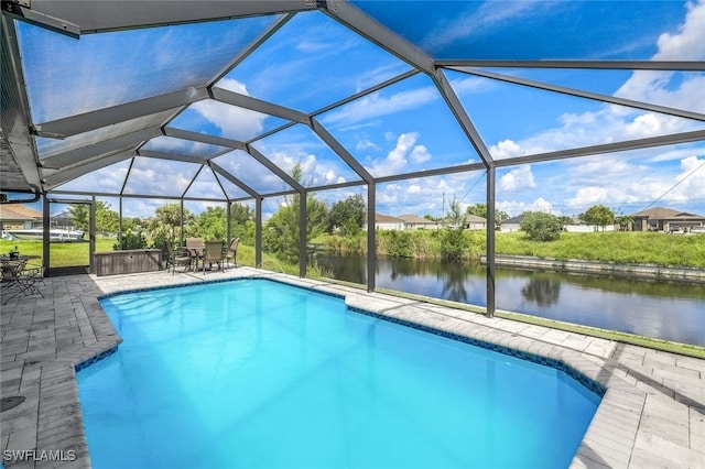 view of swimming pool with a lanai, a patio, and a water view