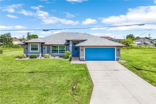 view of front facade with a front yard and a garage