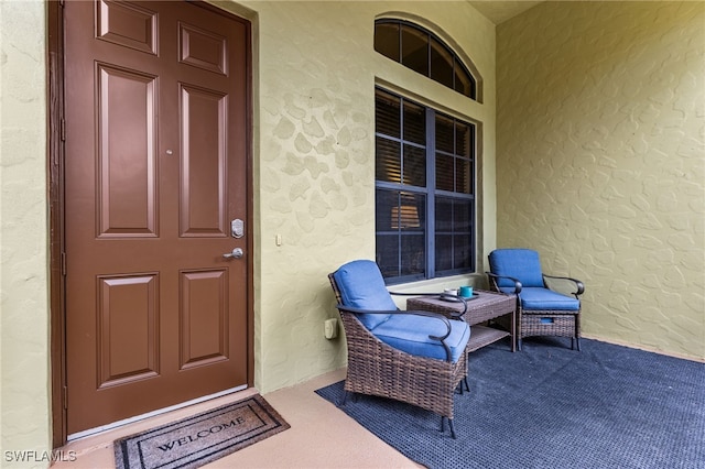 property entrance featuring a porch