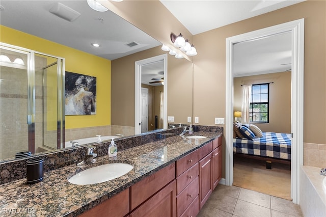 bathroom with independent shower and bath, vanity, ceiling fan, and tile patterned floors