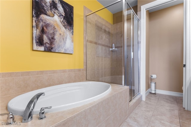 bathroom featuring shower with separate bathtub and tile patterned flooring