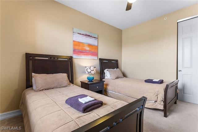 carpeted bedroom featuring ceiling fan