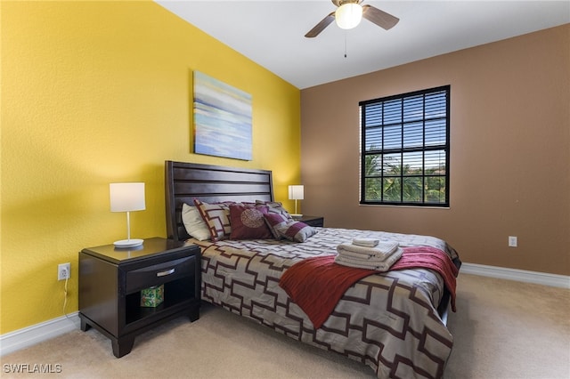 bedroom featuring ceiling fan and light colored carpet