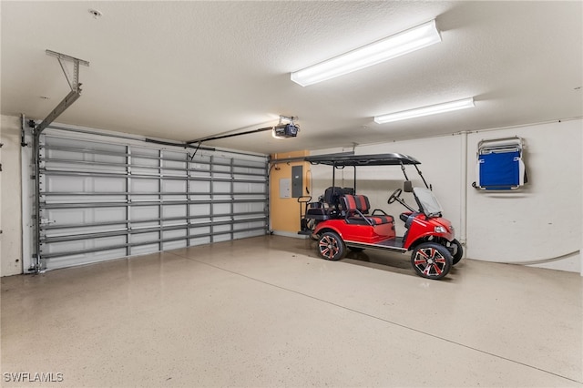 garage featuring electric panel and a garage door opener