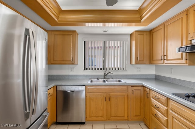 kitchen featuring a wealth of natural light, crown molding, stainless steel appliances, and sink