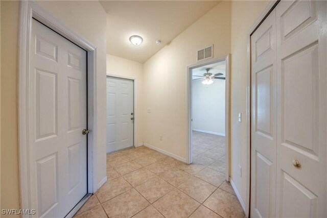 hallway featuring light tile patterned floors