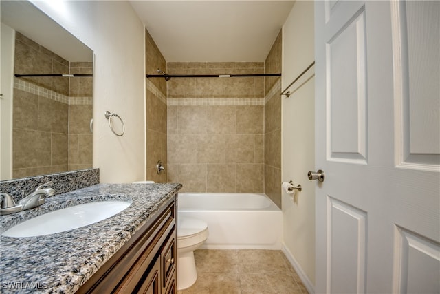 full bathroom featuring tiled shower / bath combo, vanity, toilet, and tile patterned floors