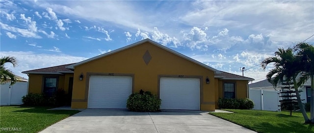 ranch-style home with an attached garage, fence, a gate, stucco siding, and a front yard