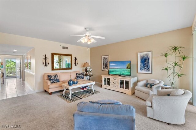 living room featuring ceiling fan and light carpet