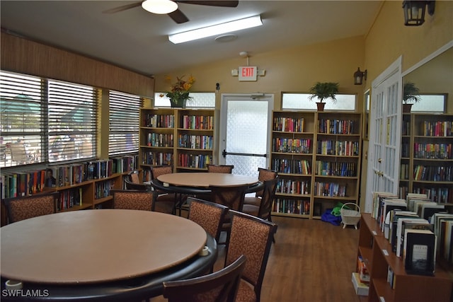 home office with vaulted ceiling, wood-type flooring, and ceiling fan