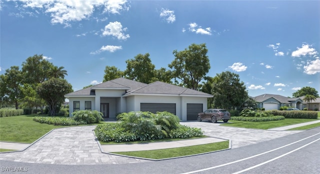 view of front of home featuring a front yard and a garage