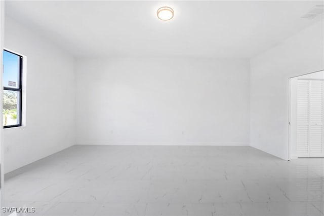 2602 73rd St W, Lehigh Acres, FL 33971 - spare room featuring marble finish floor