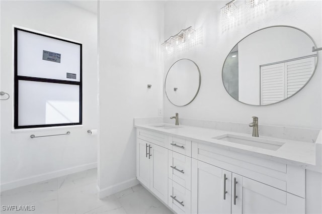 2602 73rd St W, Lehigh Acres, FL 33971 - bathroom featuring baseboards, marble finish floor, a sink, and double vanity