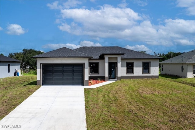 2602 73rd St W, Lehigh Acres, FL 33971 - prairie-style house with roof with shingles, concrete driveway, stucco siding, a front lawn, and a garage