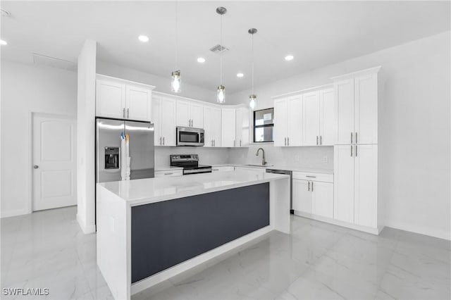 2602 73rd St W, Lehigh Acres, FL 33971 - kitchen with decorative backsplash, marble finish floor, appliances with stainless steel finishes, a sink, and a center island