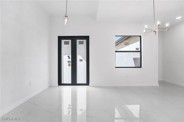 empty room featuring a notable chandelier and elevator