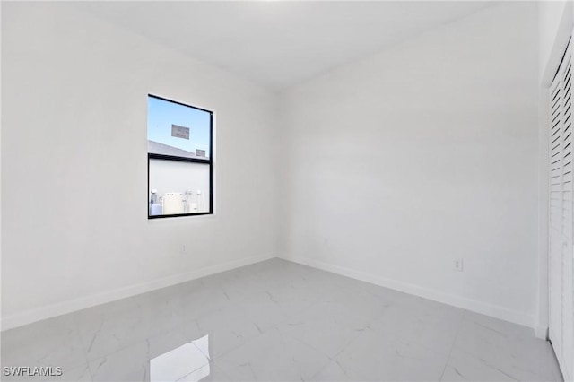 2602 73rd St W, Lehigh Acres, FL 33971 - spare room featuring marble finish floor and baseboards