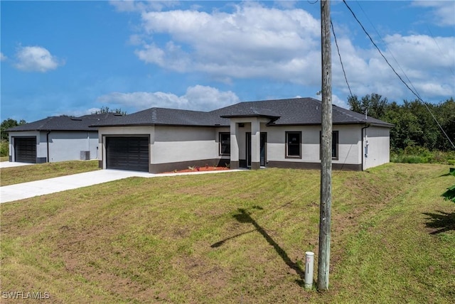 2602 73rd St W, Lehigh Acres, FL 33971 - prairie-style home featuring stucco siding, an attached garage, a front lawn, and concrete driveway