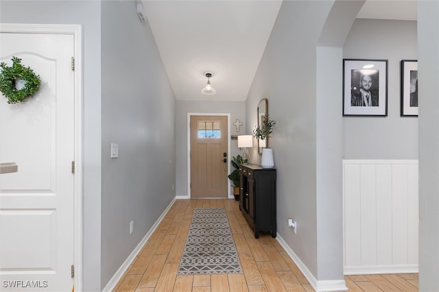 foyer entrance with light hardwood / wood-style floors