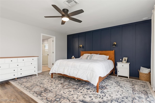 bedroom featuring ceiling fan and hardwood / wood-style floors