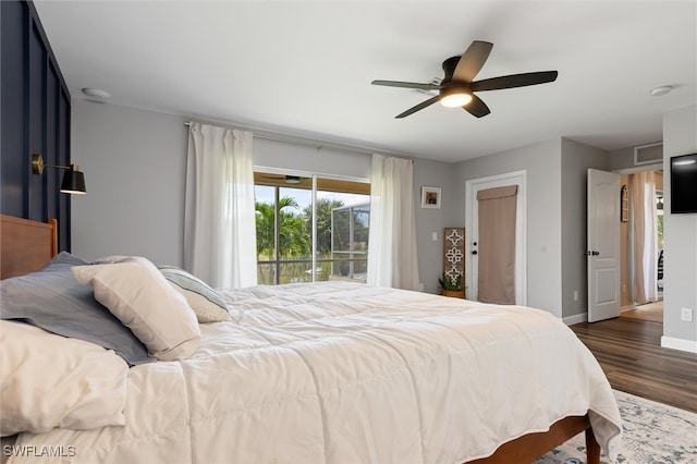 bedroom featuring ceiling fan and dark hardwood / wood-style flooring