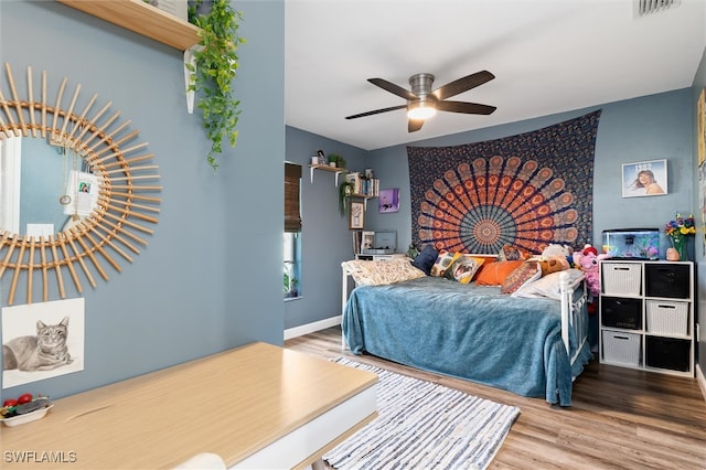 bedroom featuring hardwood / wood-style flooring and ceiling fan