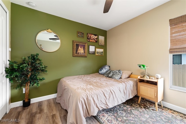 bedroom featuring hardwood / wood-style floors and ceiling fan